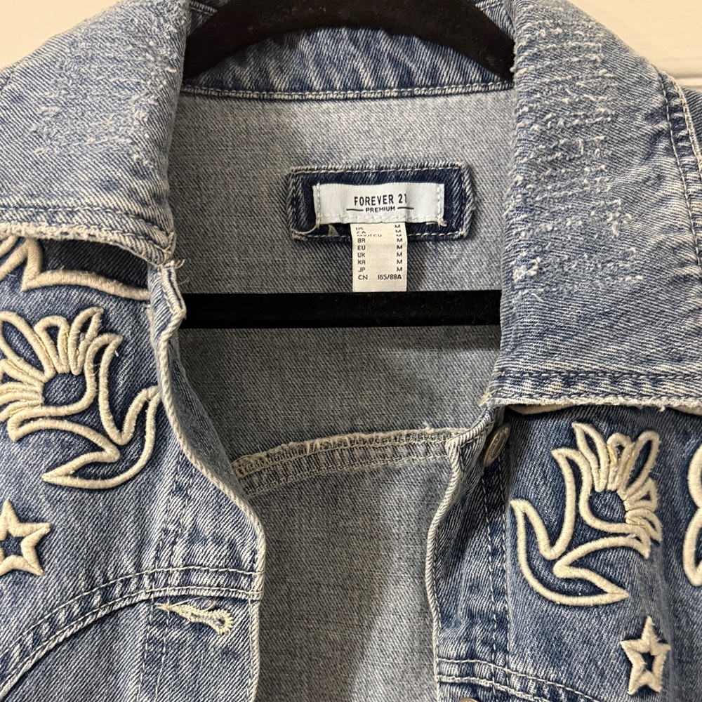 Distress denim jacket with embroidery